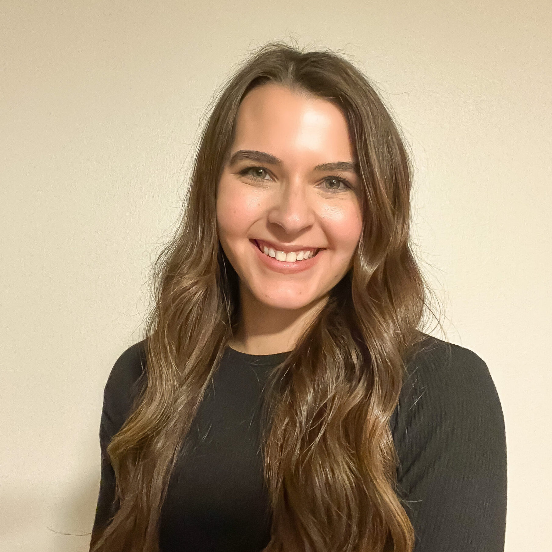 Woman with dark hair smiling