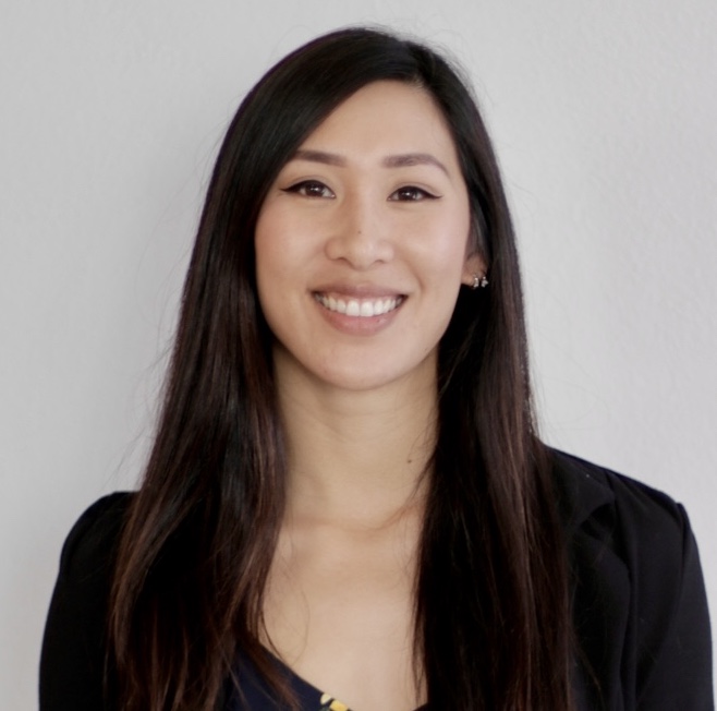 Woman with dark hair smiling